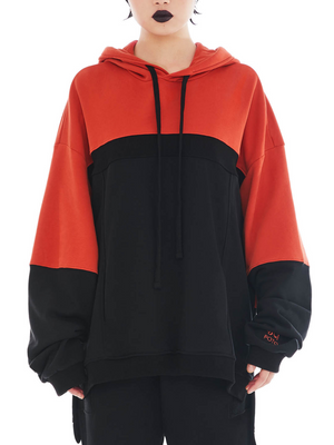front of coral and black upcycled hoodie made from organic cotton